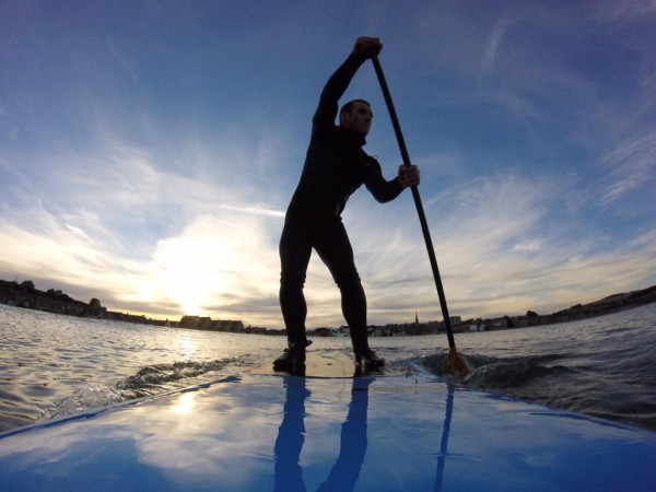 Stonehaven Paddleboarding in North Sea with Stonehaven in background