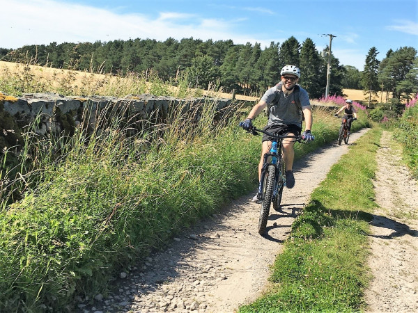 Cycling on dirt trail on a sunny day