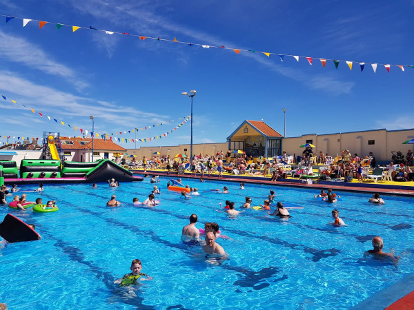 Stonehaven Outdoor Open Air Pool, swimmers, blue skies